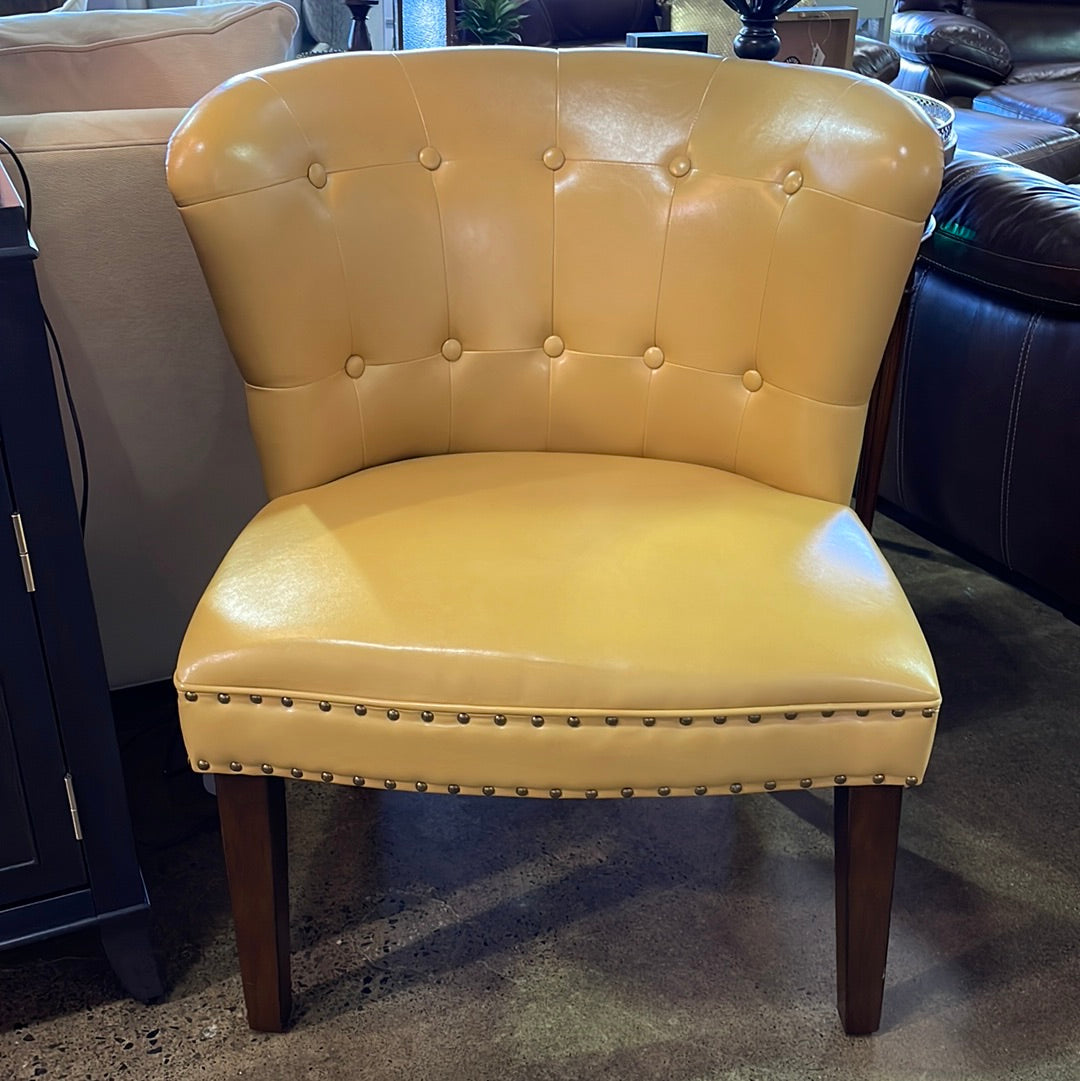 Yellow faux leather accent chair