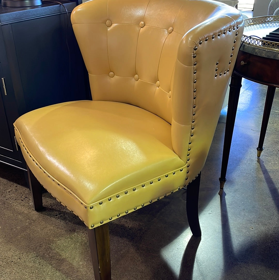 Yellow faux leather accent chair