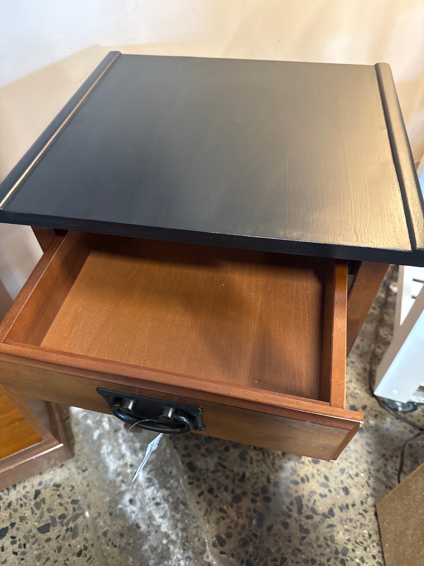 Black topped end table with drawer