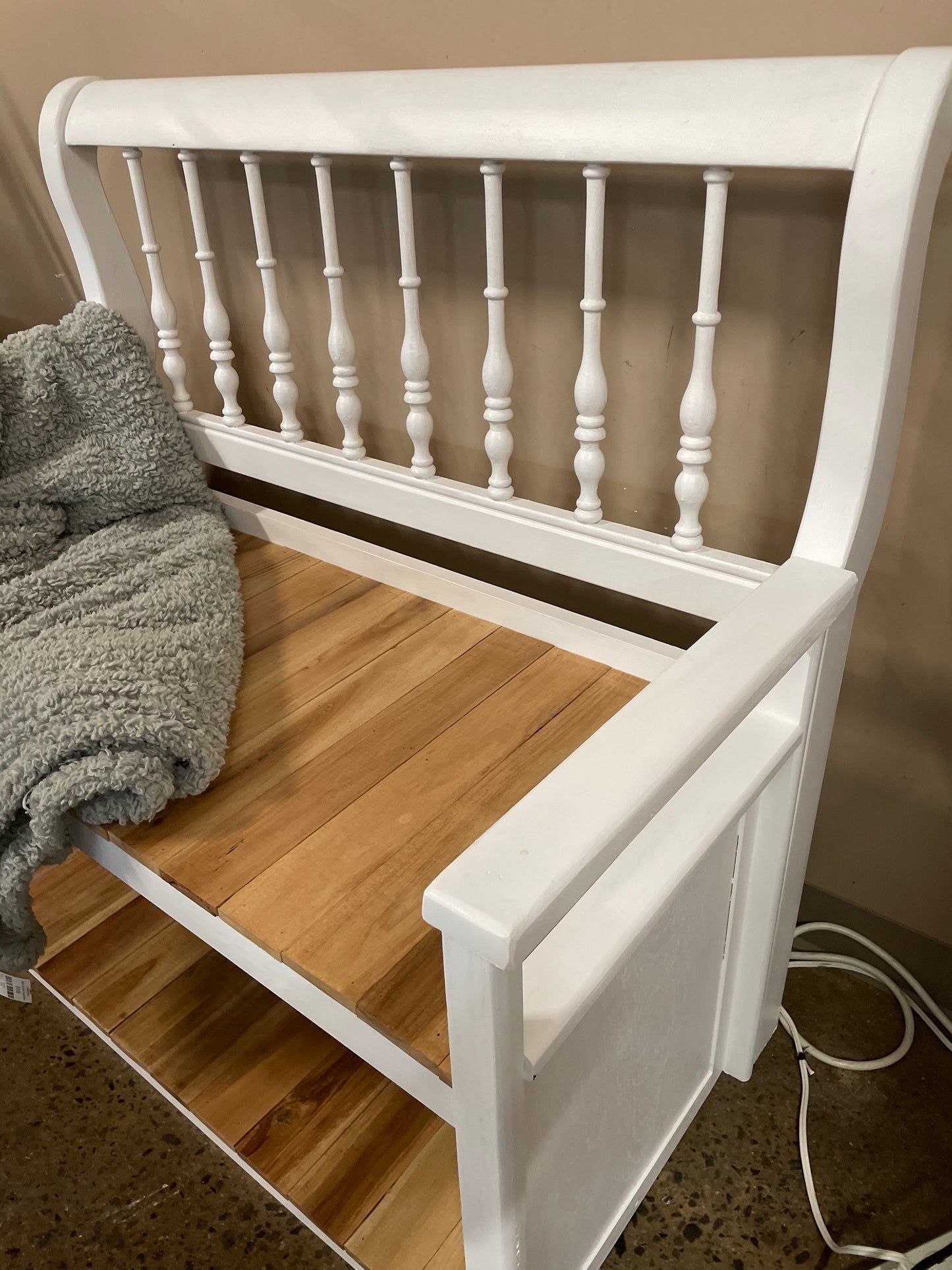 White bench with natural wood slat seat