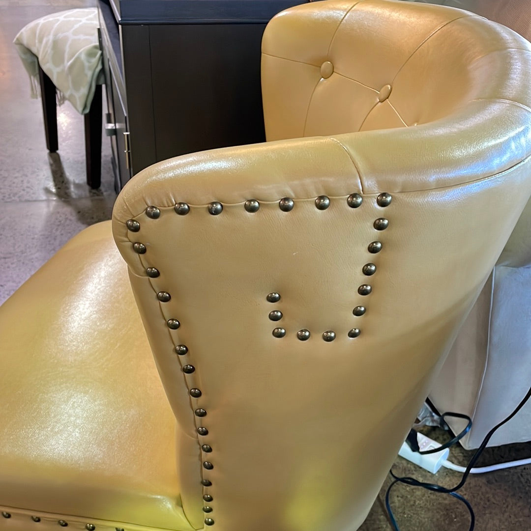 Yellow faux leather accent chair