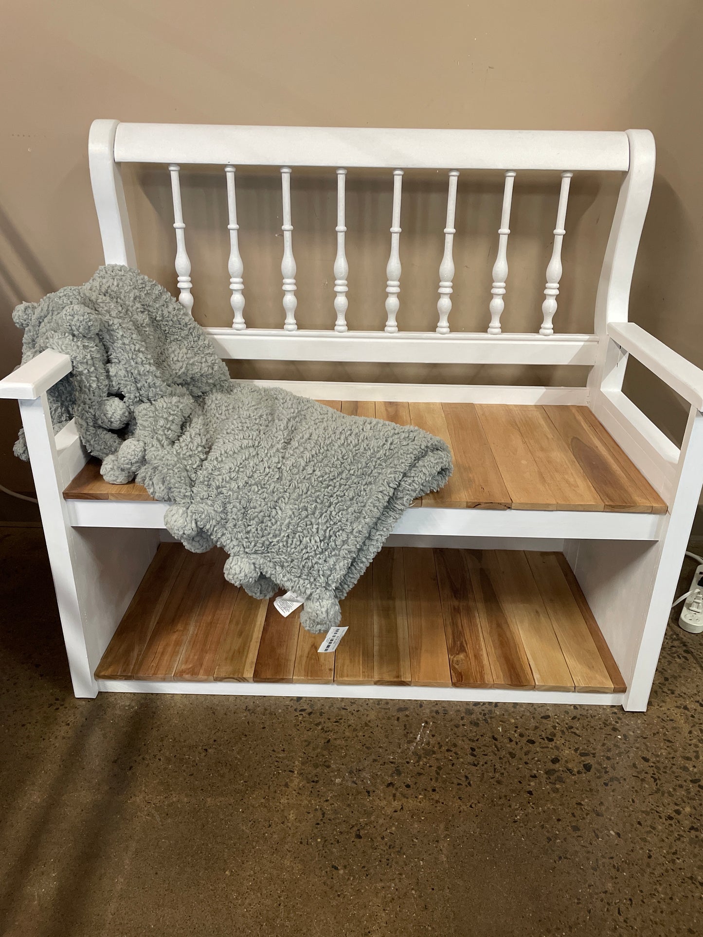 White bench with natural wood slat seat