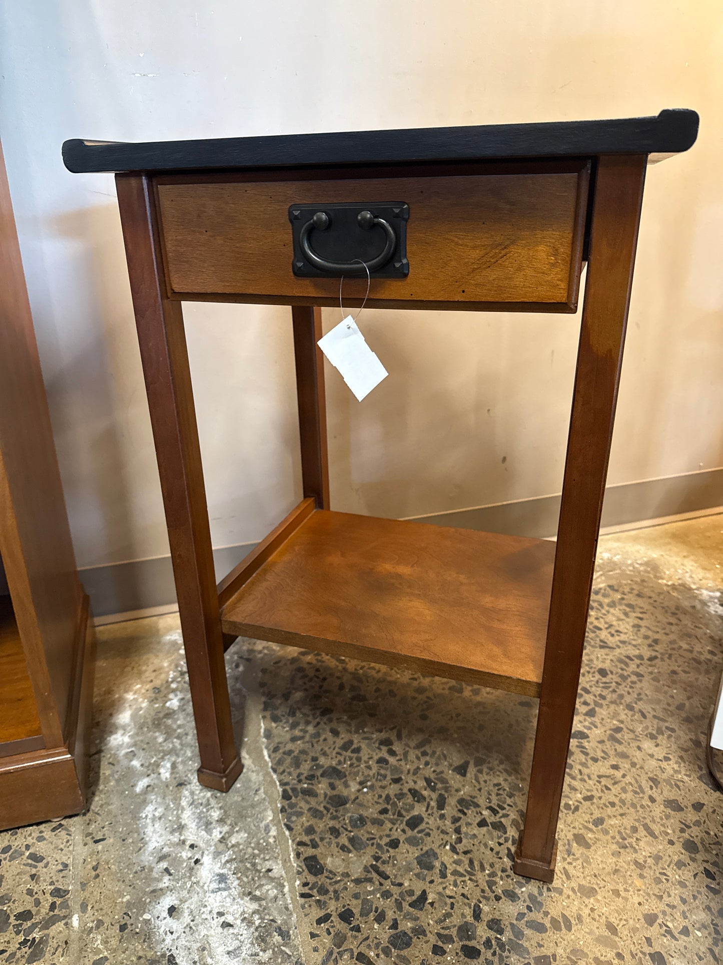 Black topped end table with drawer