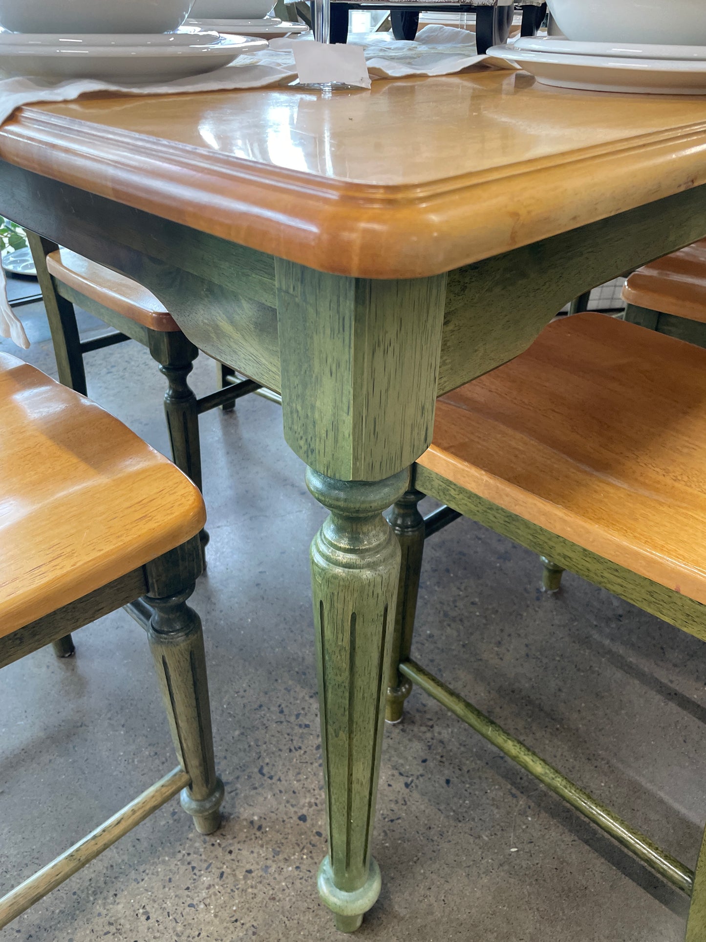 Wood top, green base kitchen table