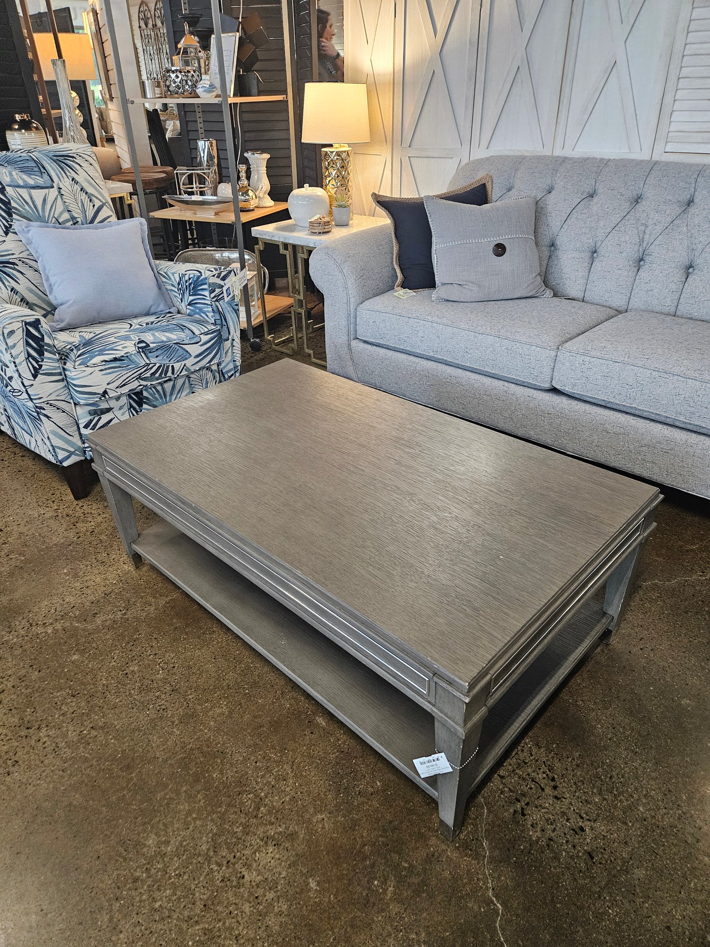 Gray wood coffee table with bottom wheels