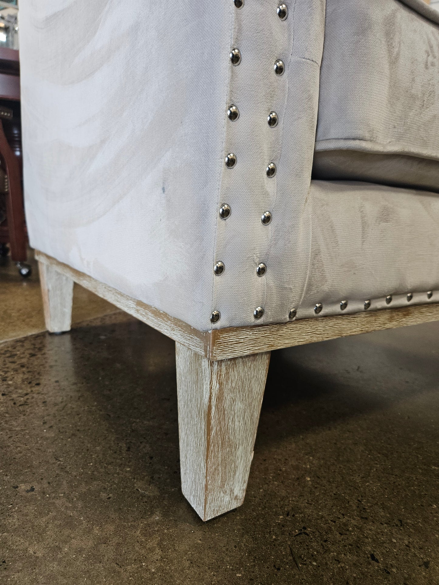 Creamy snow accent chair with nail head trim