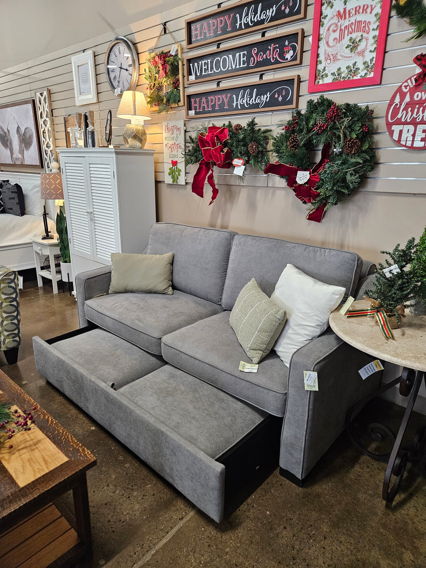 Gray loveseat with pullout bottom level