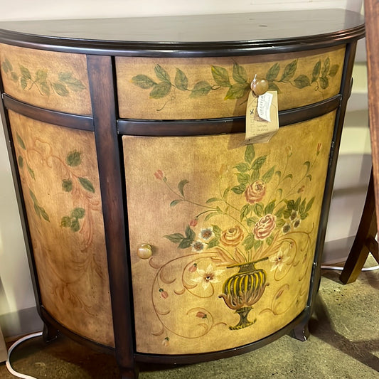 Demilune cabinet with flower