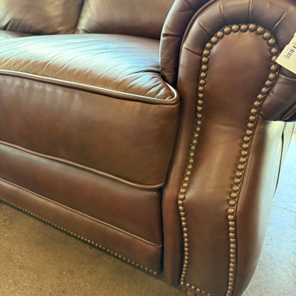 Brown leather reclining sofa