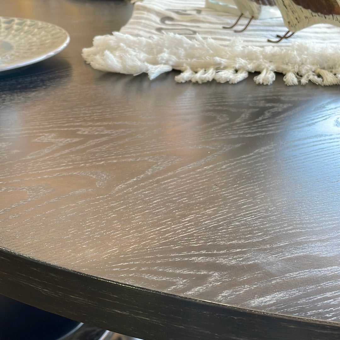 Black pedestal table with chairs