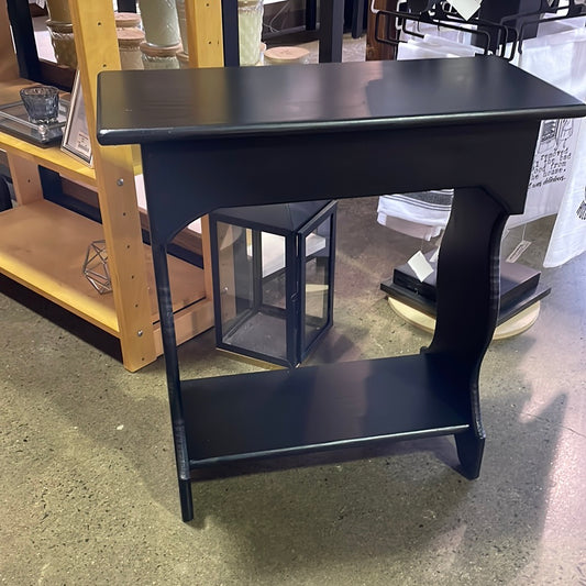 Black table with bottom shelf
