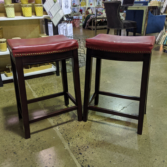 Red leather like set of counter height stools