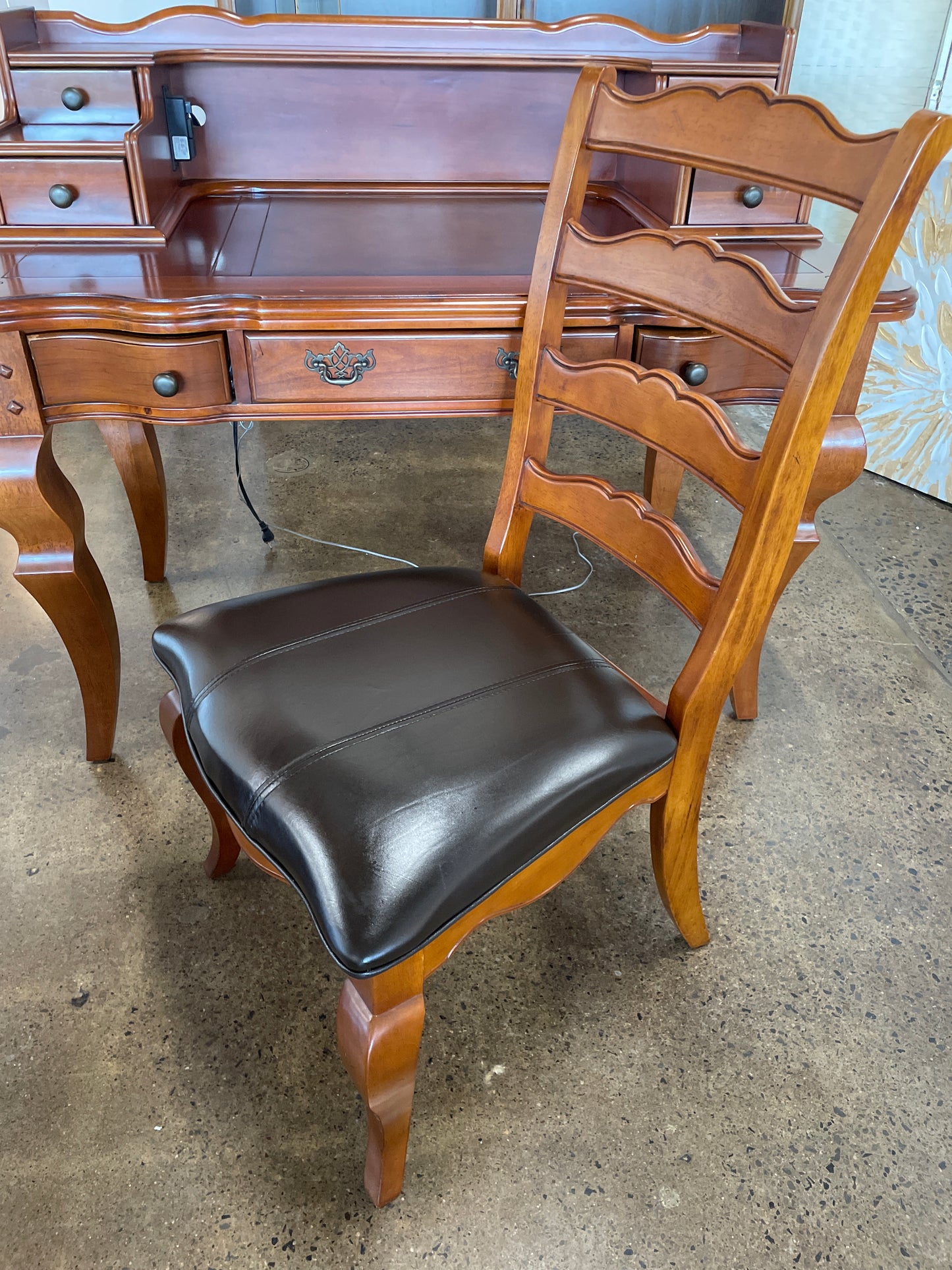 Wooden desk with drawers and chair