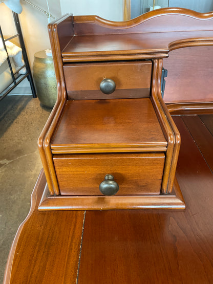 Wooden desk with drawers and chair