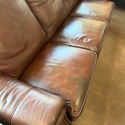 Brown leather reclining sofa