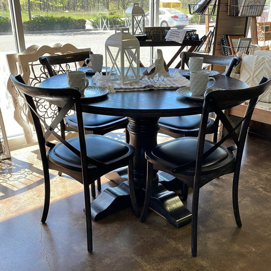 Black pedestal table with chairs