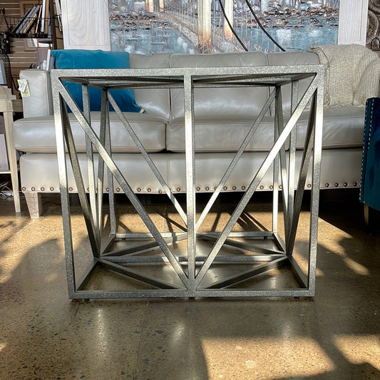 Grey and silver colored metal glass top table