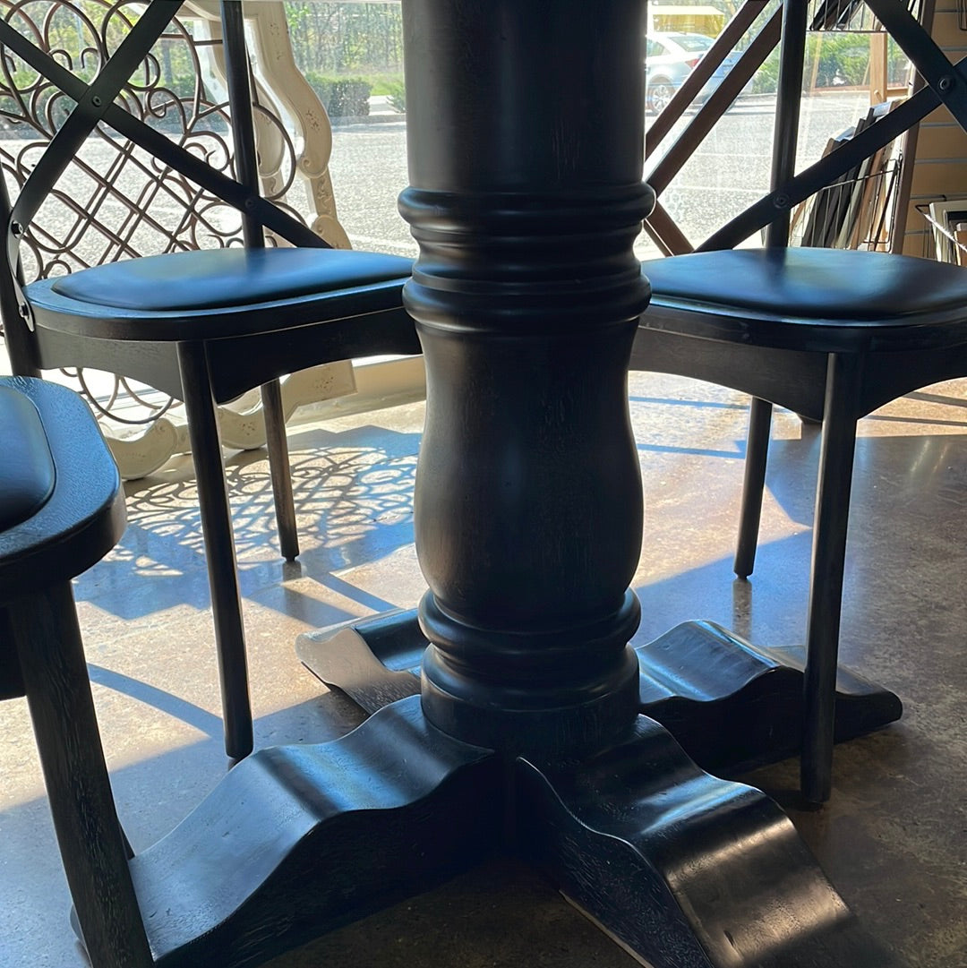 Black pedestal table with chairs