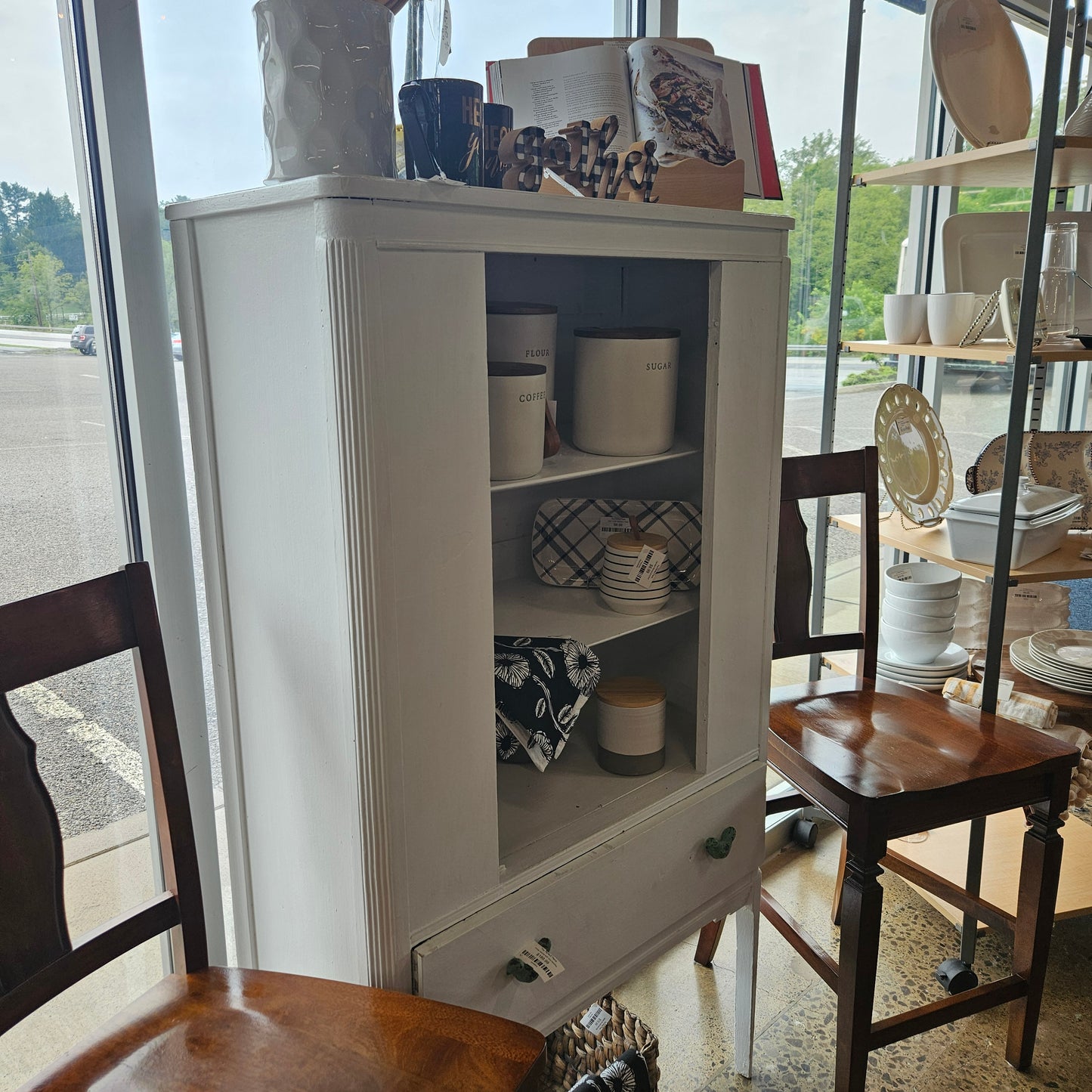 White cabinet with bird handles