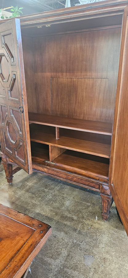 Red oak armoire with carved cabinet doors