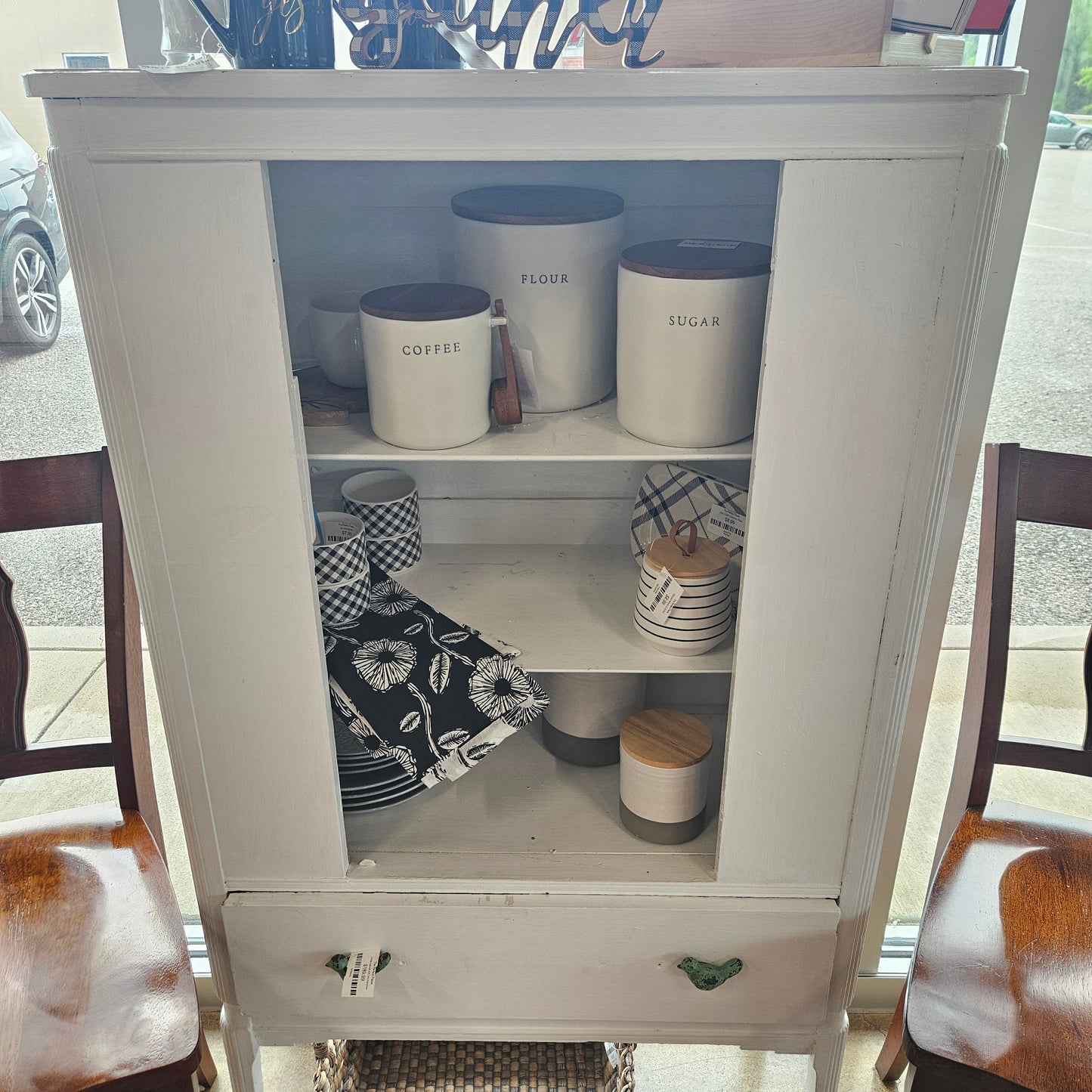 White cabinet with bird handles