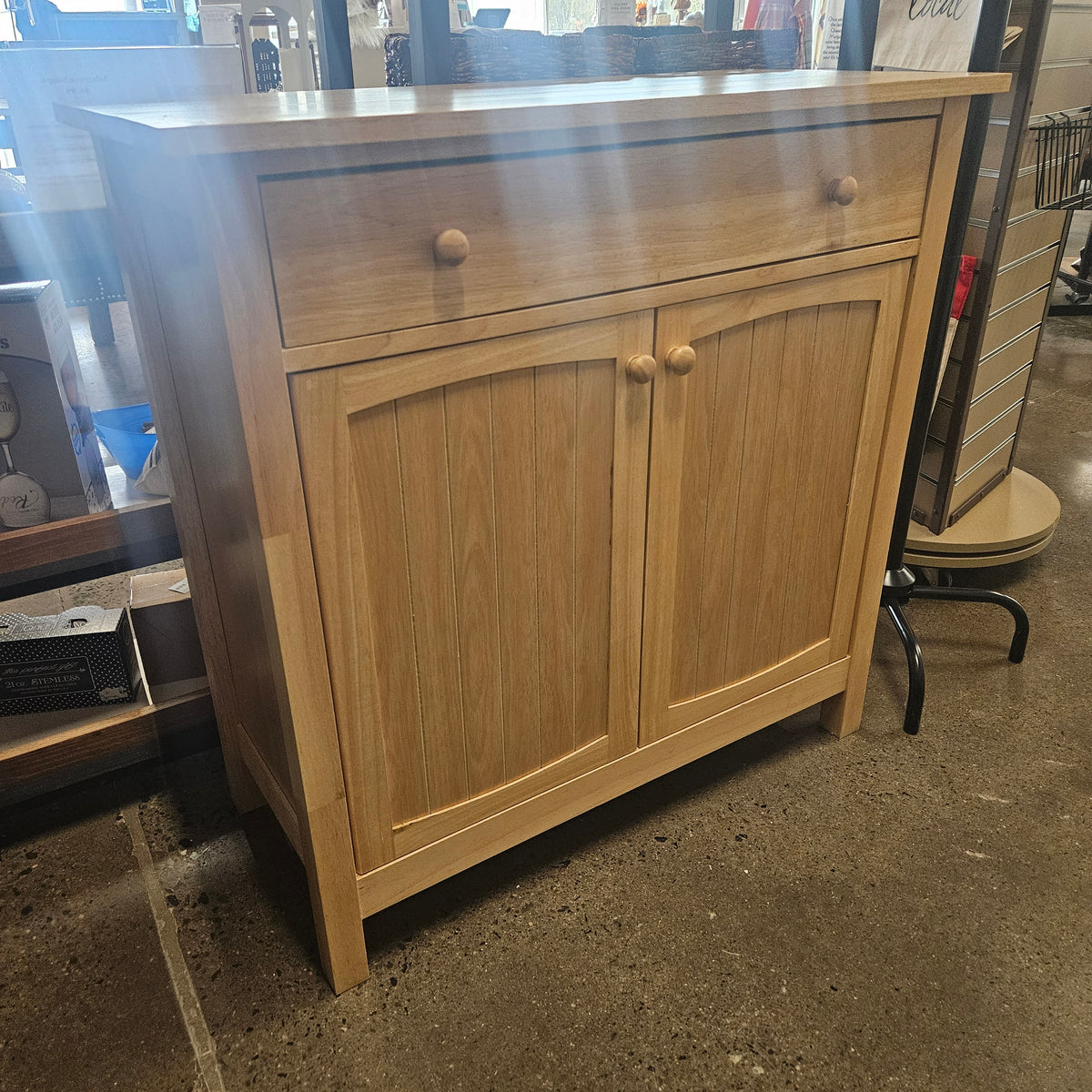 Light wood storage cabinet with single top drawer