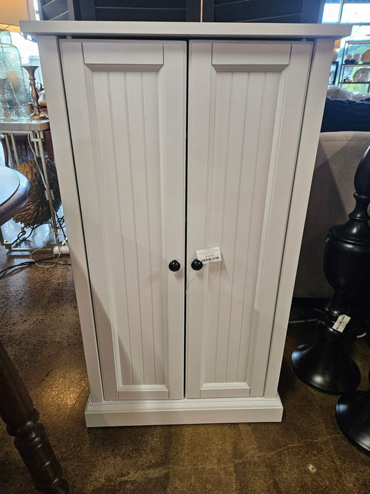 White tall storage cabinet with shelves