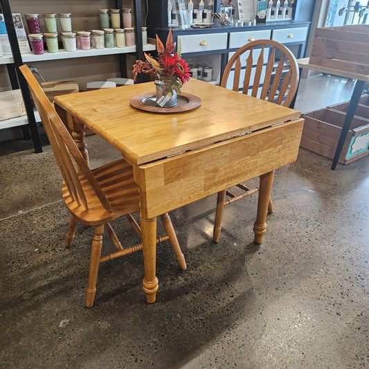 Oak drop leaf table with 2 arrowback chairs