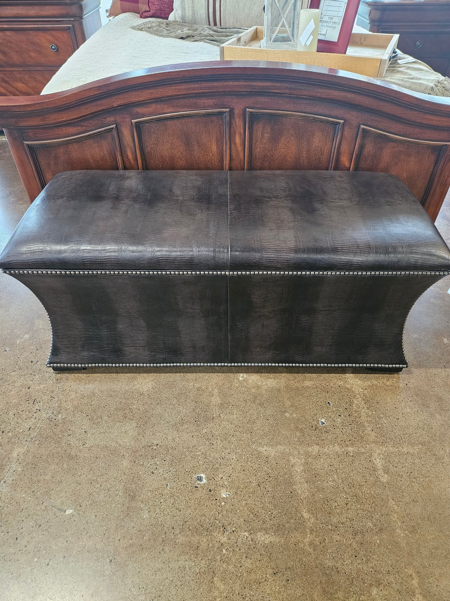Brown patterned ottoman  with silver nailhead trim