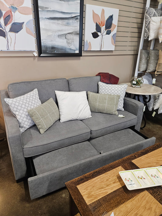 Gray loveseat with pullout bottom level