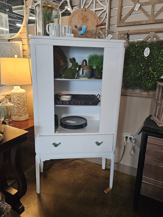 White cabinet with bird handles