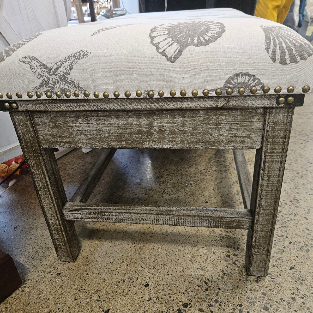 Wooden bench with seashell fabric
