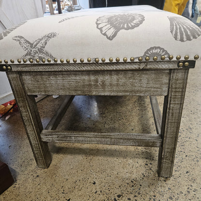 Wooden bench with seashell fabric