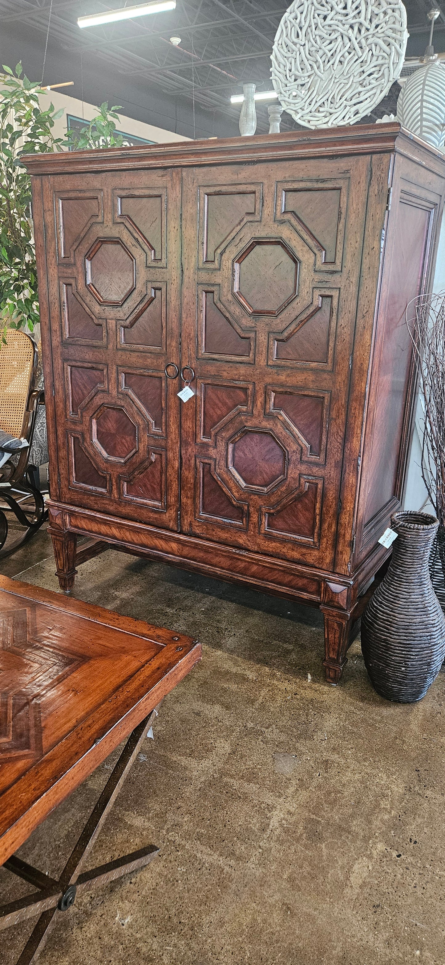 Red oak armoire with carved cabinet doors