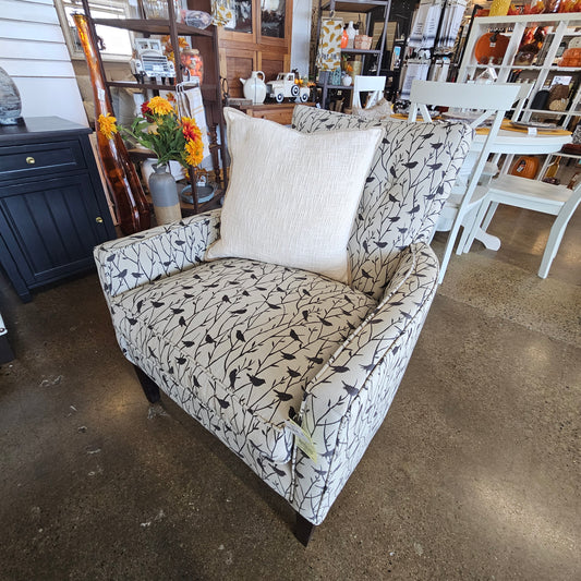 Beige chair with dark birds