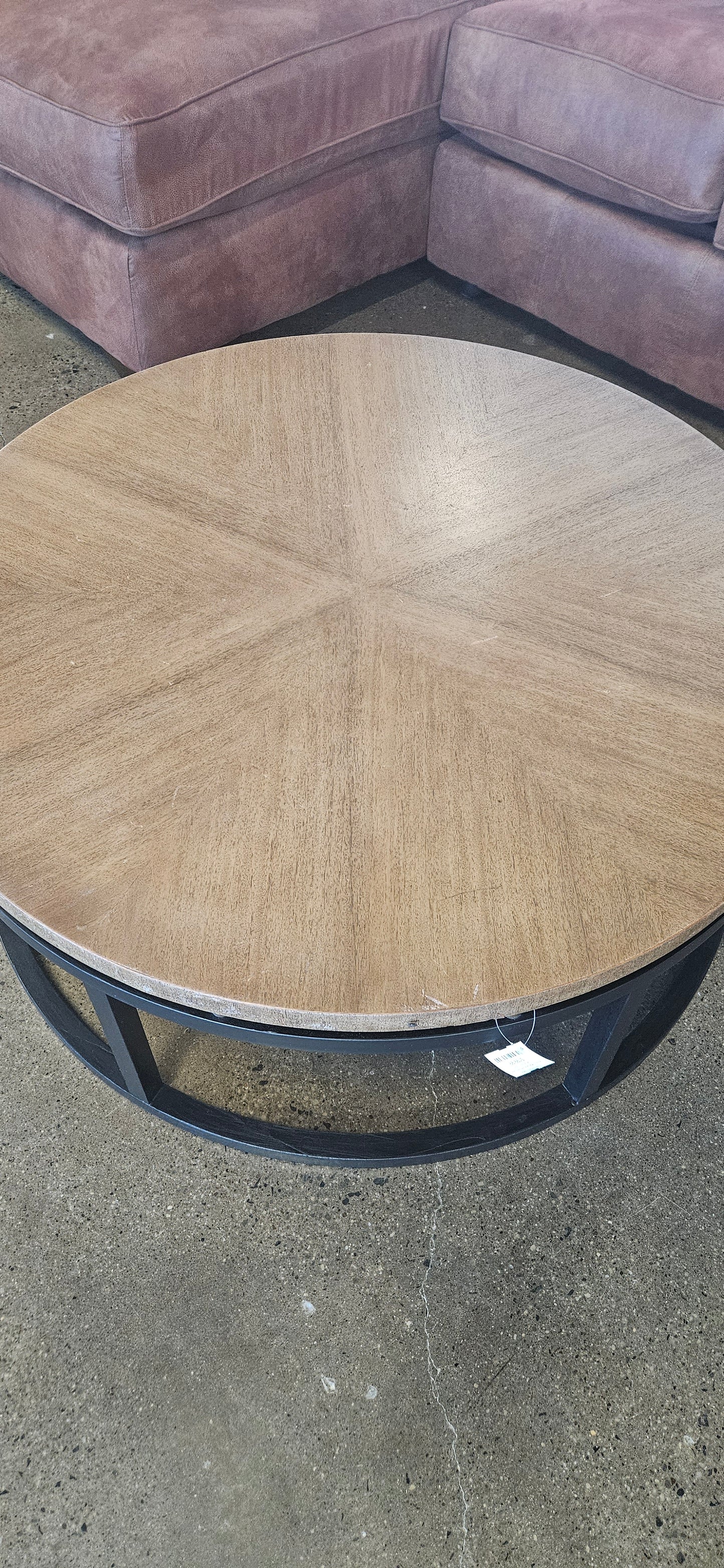 Round coffee table with black base