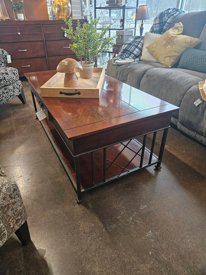 Dark wood coffee table with metal legs and drawer