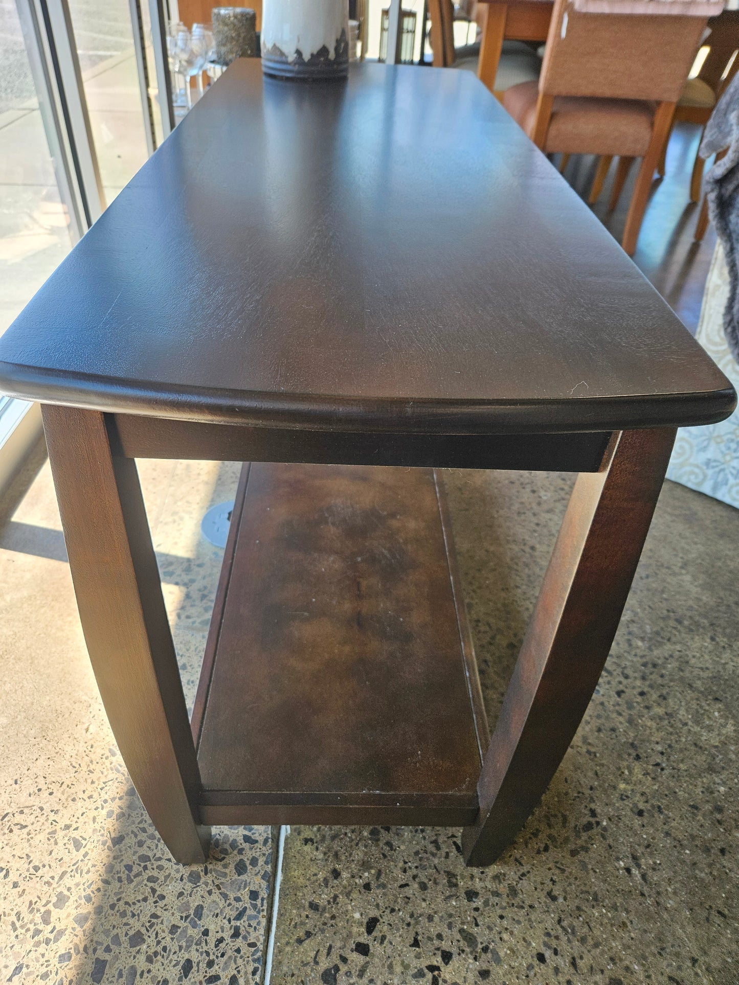 Dark sofa table with bottom shelf