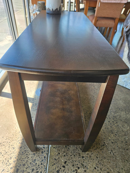 Dark sofa table with bottom shelf
