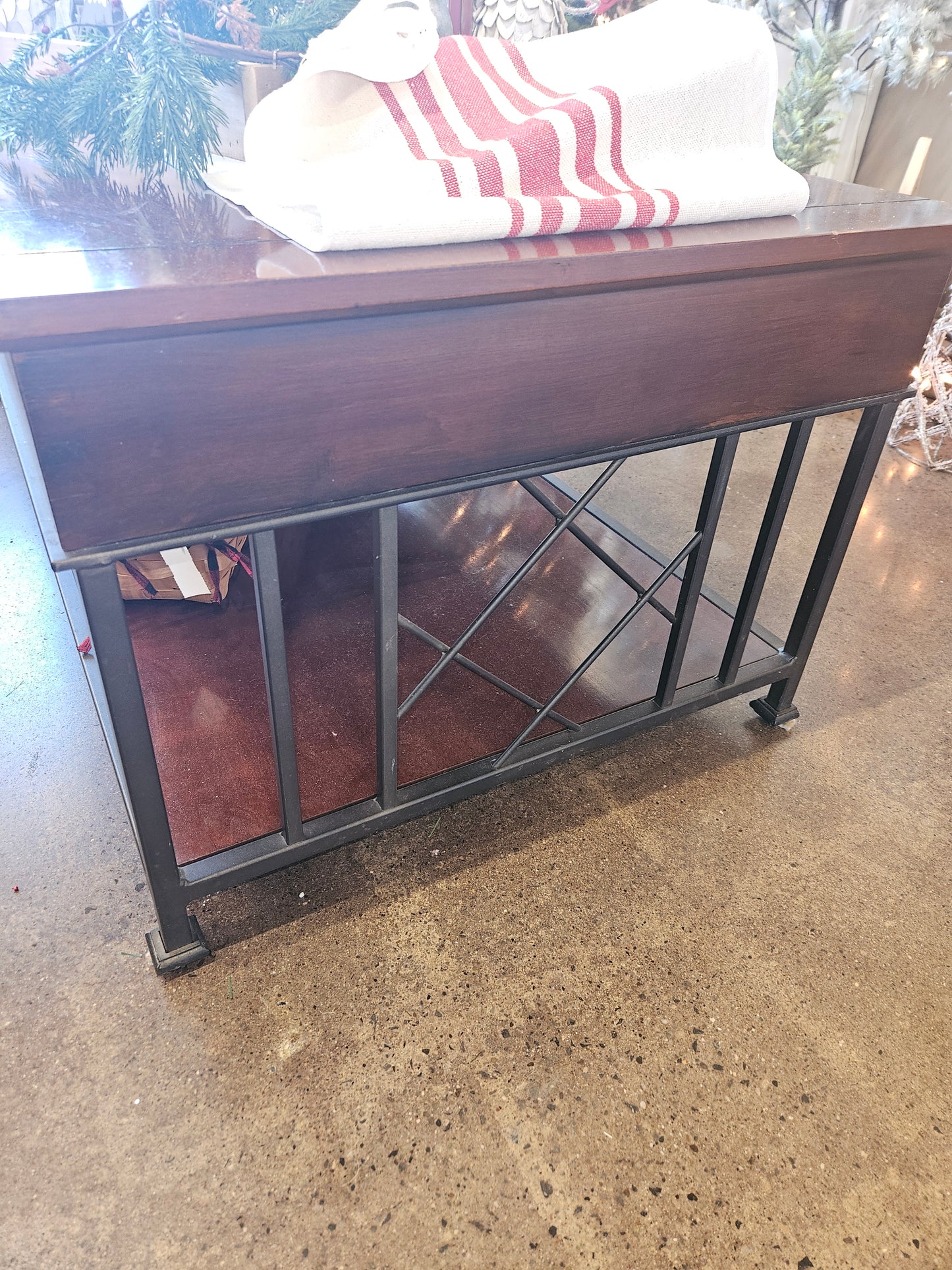 Dark wood coffee table with metal legs and drawer