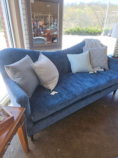 Blue curved top sofa