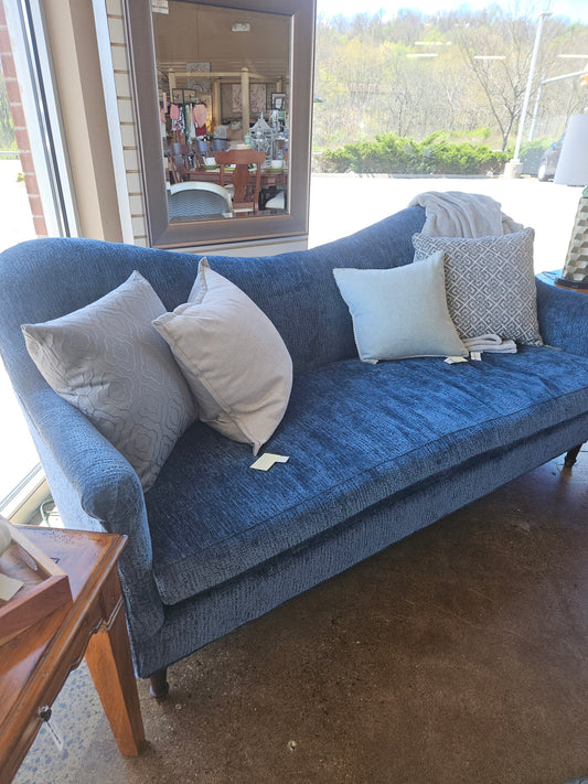 Blue curved top sofa
