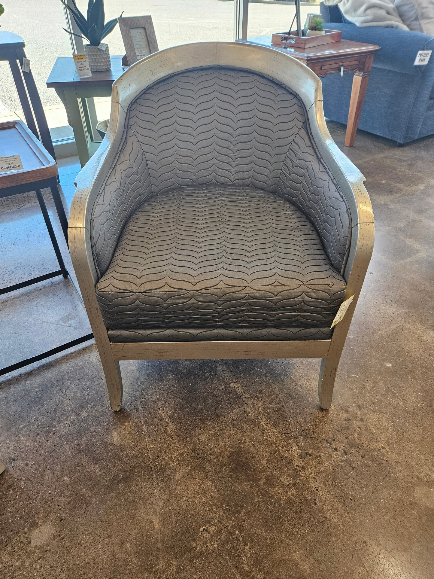Taupe upholstered barrel chair