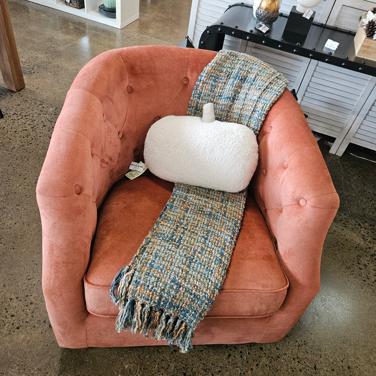 Burnt orange swivel chair (NEW from Model Home)