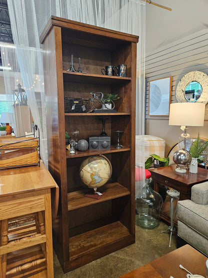 Tall dark wood bookshelf