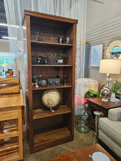 Tall dark wood bookshelf