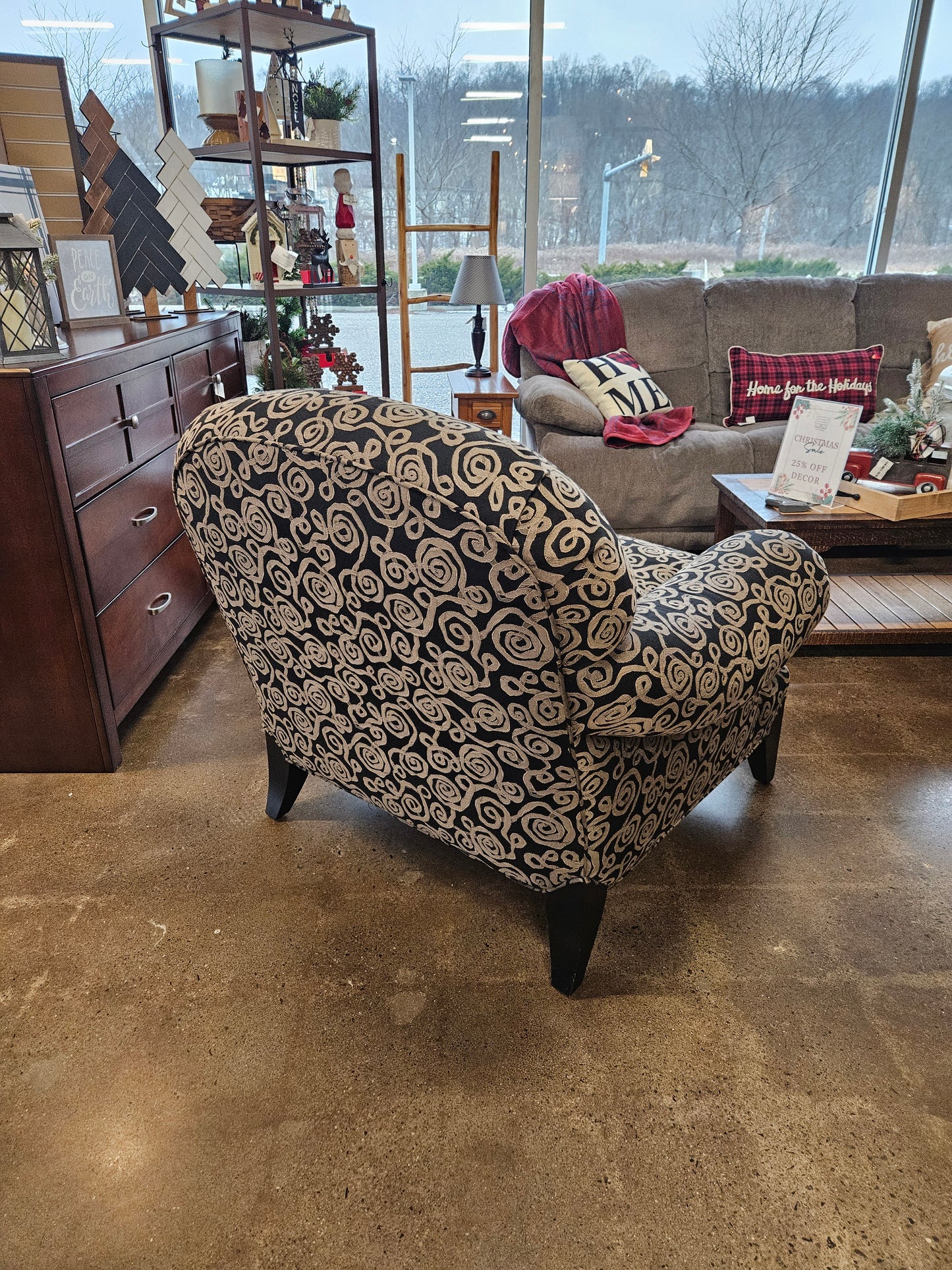 Dark armchair with silver swirls