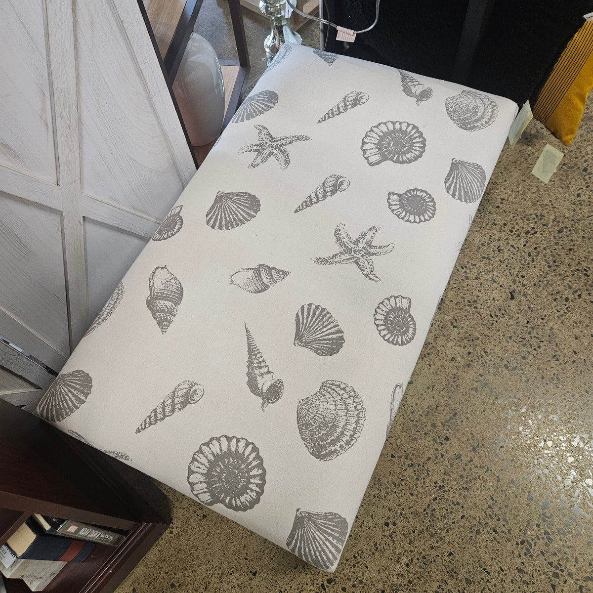 Wooden bench with seashell fabric
