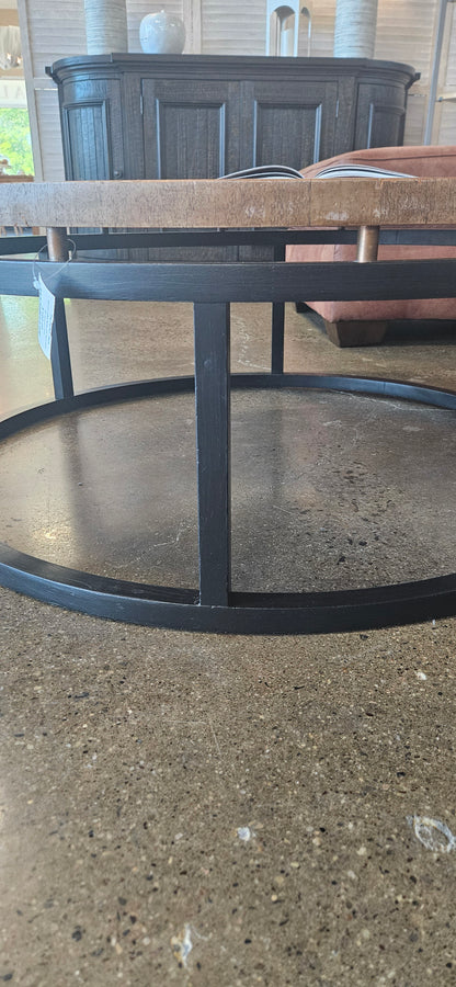 Round coffee table with black base