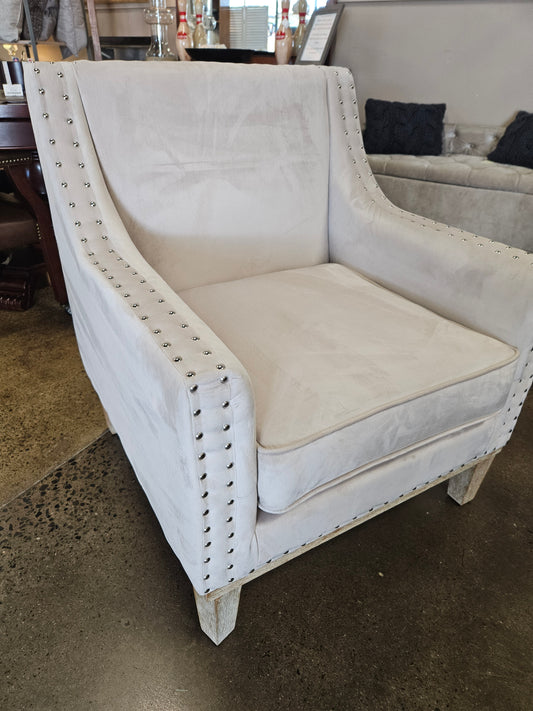 Creamy snow accent chair with nail head trim